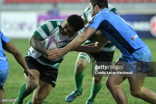 Sione Fukofuka of Krasny Yar is tackled during the European Rugby Challenge Cup match between Krasny Yar and London Irish at Avchala Stadium on...