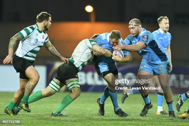 David Paice of London Irish is tackled during the European Rugby Challenge Cup match between Krasny Yar and London Irish at Avchala Stadium on...