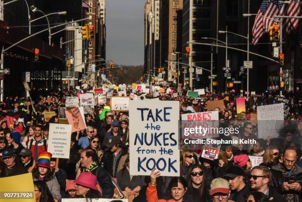 Large crowd of people participating in the Women's March makes its way down 6th Avenue in Manhattan on January 20, 2018 in New York City. Across the...