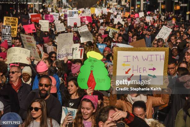 Large crowd of people participating in the Women's March makes its way down 6th Avenue in Manhattan on January 20, 2018 in New York City. Across the...