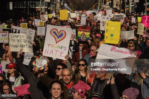 Large crowd of people participating in the Women's March makes its way down 6th Avenue in Manhattan on January 20, 2018 in New York City. Across the...