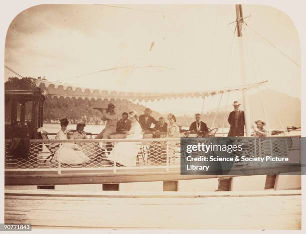 Photograph of Sir Hugh Allen , relaxing with his family on board his yacht on Lake Memphremagog in Belmere, Canada, taken by William McFarlane Notman...