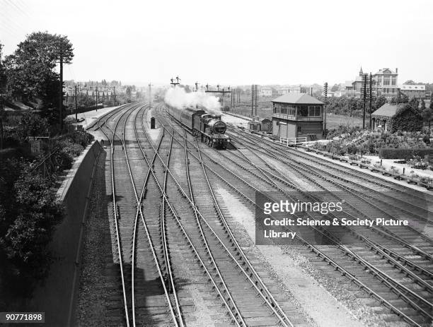 Passenger train, pulled by a 4-4-0 locomotive number 746 at Cricklewood, 30 July 1913. This section of the Midland Railway, between Bedford and...