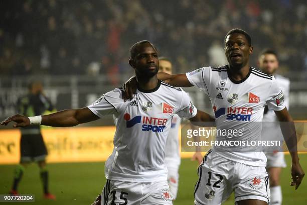 Amiens' Senegales forward Pape Moussa Konate celebrates with teammate Malian defender Bakaye Dibassy after scoring a goal during the French L1...