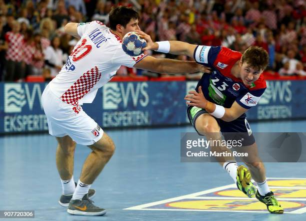 Marko Mamic of Croatia challenges Goran Johannessen of Norway during the Men's Handball European Championship main round match between Croatia and...