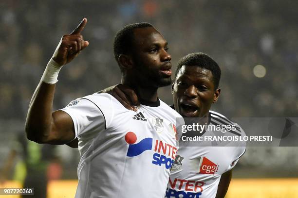 Amiens' Senegales forward Pape Moussa Konate celebrates with teammate Malian defender Bakaye Dibassy after scoring a goal during the French L1...