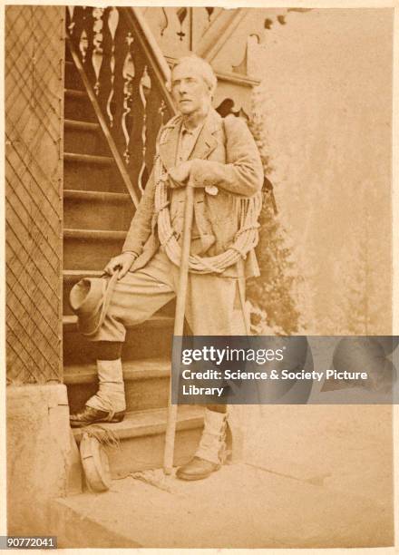 Carte de visite photograph of an unknown mountaineer wearing puttees and climbing clothing, with a length of rope over his shoulder and holding a...