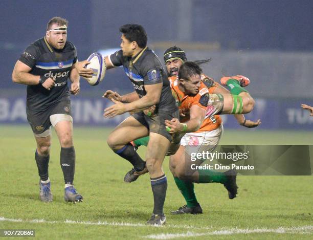 Ben Tapuai of Bath Rugby his tackled during the European Rugby Champions Cup match between Benetton Rugby and Bath Rugby at Stadio Comunale Monigo on...