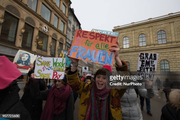 Feminists hold banners during the women's march against against US-president Donald Trump's sexism in Munich, Germany, on 20 January 2018.