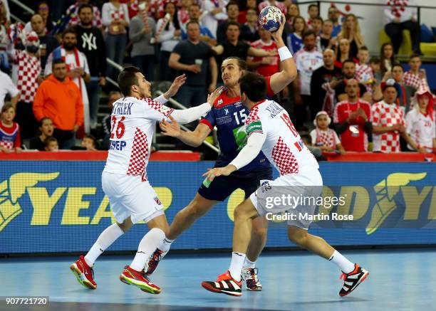 Manuel Strlek and Igor Karacic of Croatia challenge Kent Robin Tonnesen of Norway during the Men's Handball European Championship main round match...