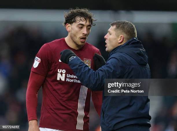 Matt Crooks of Northampton Town listens to instructions from Dean Austin during the Sky Bet League One match between Northampton Town and Milton...