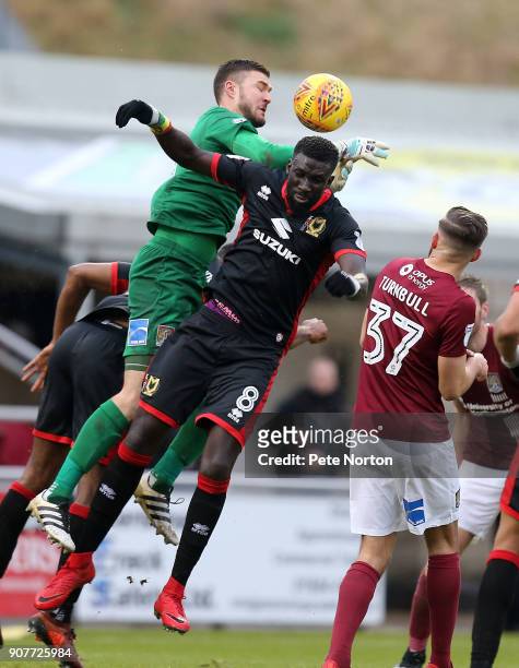 Richard O'Donnell of Northampton Town attempts to collect the ball under pressure from Ousseynou Cisse of Milton Keynes Dons in action during the Sky...