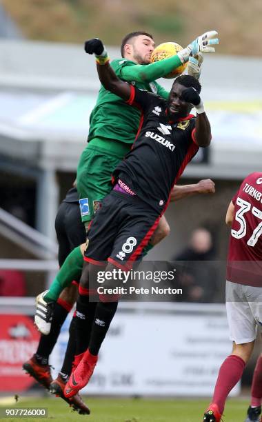 Richard O'Donnell of Northampton Town attempts to collect the ball under pressure from Ousseynou Cisse of Milton Keynes Dons in action during the Sky...