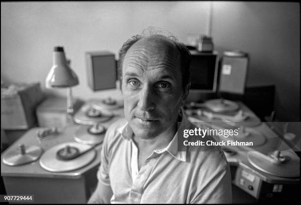 Portrait of American actor and film director Robert Duvall as he sits in a film editing suite, New York, New York, July 1981. Behind him is Steenbeck...