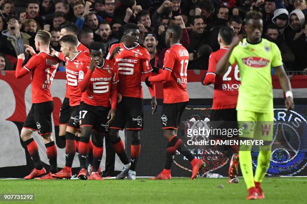 Rennes' French midfielder Benjamin Bourigeaud celebrates with teammates and supporters after scoring a goal during the French L1 football match...