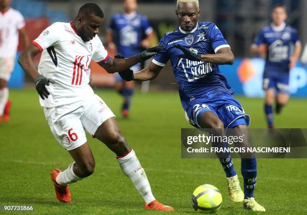 Troyes' Malian forward Adama Niane vies with Lille's midfielder Ibrahim Amadou during the French L1 football match between Troyes and Lille on...