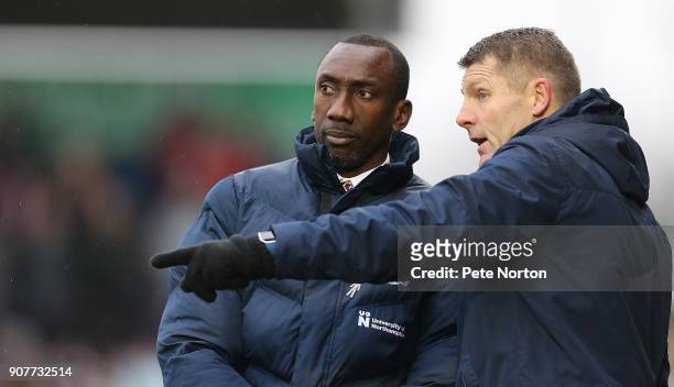 Northampton Town assistant manager Dean Austin makes a point to Manager Jimmy Floyd Hasselbaink during the Sky Bet League One match between...