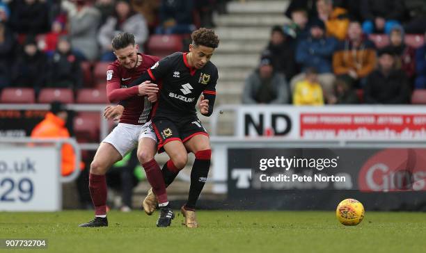 Marcus Tavernier of Milton Keynes Dons contests the ball with Matt Grimes of Northampton Town during the Sky Bet League One match between Northampton...