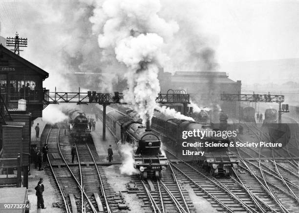 The "Flying Scotsman", pulled by an A3 class 4-6-0 locomotive number 4475 "Flying Fox", leaving King's Cross station, about 1930. Several other...