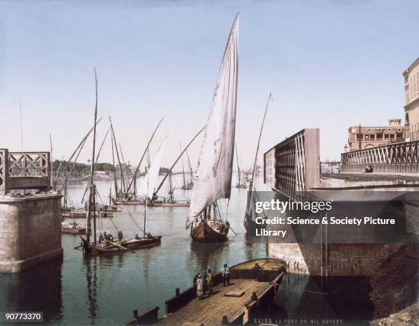 Dhows sailing on the Nile navigate an open swing bridge, near Cairo in Egypt. Early attempts at colour photography utilized three consecutive...