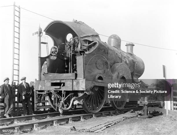 Damaged 4-4-0 locomotive number 1105 at Moss Side, Lancashire. The locomotive has been severely dented and beyond that there are some crushed and...