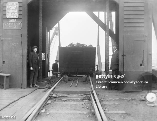 It is likely that the coal is waiting to be shipped abroad. Garston docks were owned by the London, Midland & Scottish Railway. They shipped between...