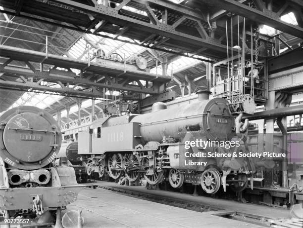 Two class P1 4-6-4 locomotives number 11118 and 11119 in Horwich works erecting shop. This shop was where the locomotives were put together. It was...