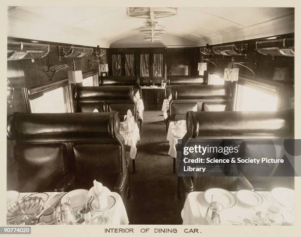 Inside a Great Indian Peninsula Railway dining car, probably first class. At this time long distance trains had dining cars, but some shorter...