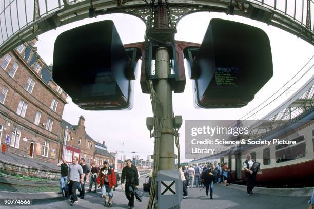 Passengers leaving a train at Ayr station, South Ayrshire, by Lynn Patrick, 24 August 2001. This station mainly serves Scotrail trains. Scotrail was...