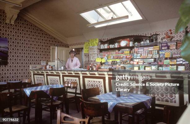 Inside the cafe at Malton station, North Yorkshire, 1981. This station is on the line between York and Scarborough. The canteen is selling drinks and...