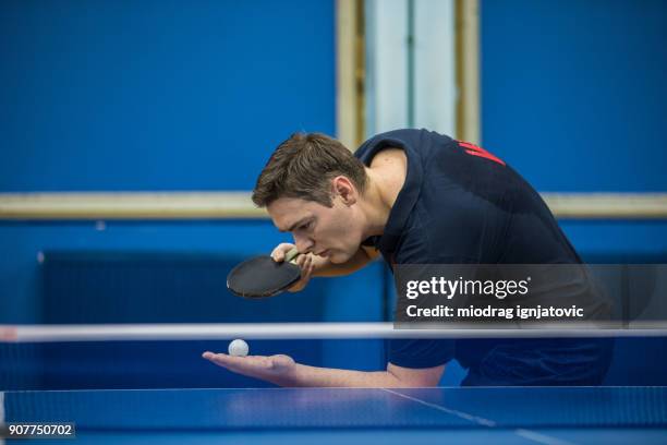 mature man serving in table tennis - table tennis stock pictures, royalty-free photos & images