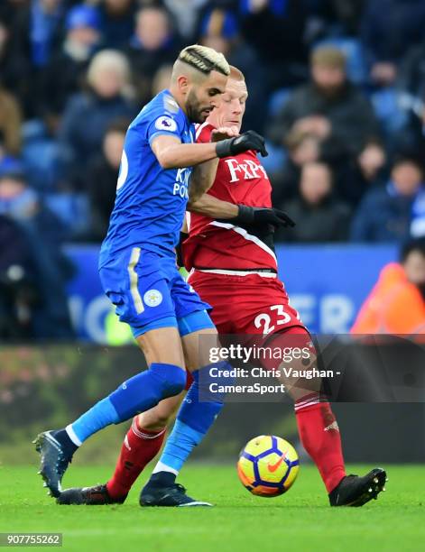 Leicester City's Riyad Mahrez vies for possession with Watford's Ben Watson during the Premier League match between Leicester City and Watford at The...