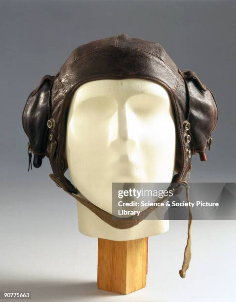 Leather flying helmet with zipped ear pockets and fittings for an oxygen mask. At the outbreak of WWII , flying helmets had changed little since WWI...