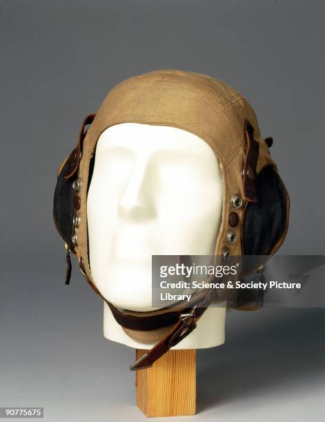 Silk-lined fabric flying helmet with neck flap and zipped ear pockets, made for the Air Ministry. At the outbreak of WWII , flying helmets had...
