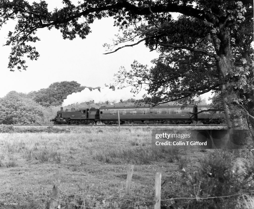A steam train approaches Lymington Junction, Hampshire, 1966.