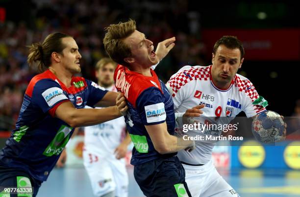 Igor Vori of Croatia challenges Kristian Bjornsen of Norway during the Men's Handball European Championship main round match between Croatia and...