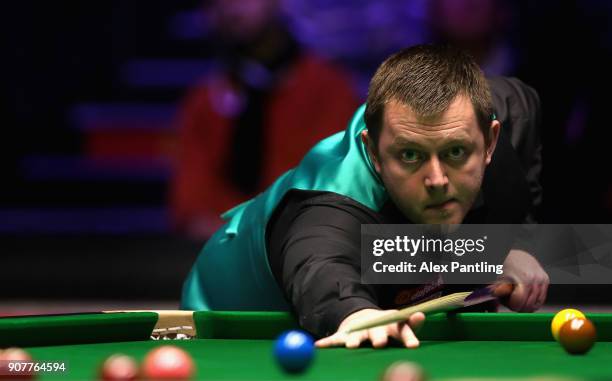 Mark Allen plays a shot during the Semi-Final match between Mark Allen and John Higgins on Day Seven of The Dafabet Masters at Alexandra Palace on...