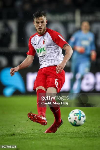 Jeffrey Gouweleeuw of Augsburg controls the ball during the Bundesliga match between Borussia Moenchengladbach and FC Augsburg at Borussia-Park on...
