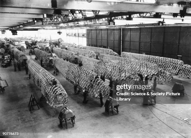 Workers assembling the fuselages of Wellington bombers at the Vickers factory at Castle Bromwich, Birmingham. The Wellington bomber was designed by...