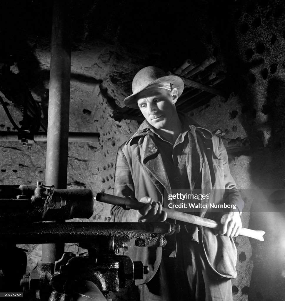 A young tin and copper miner working underground, Cornwall, 1948.