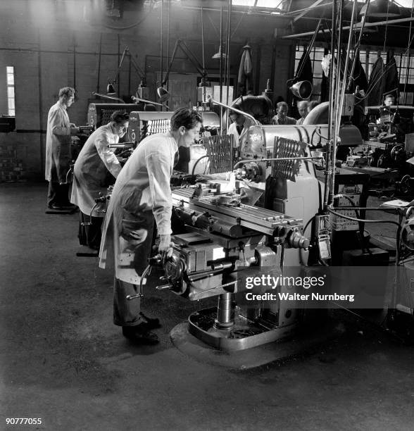 Fitters at their lathes in the machine shop of SIma engineering, Letchworth..Photograph by Walter Nurnberg, who transformed industrial photography...