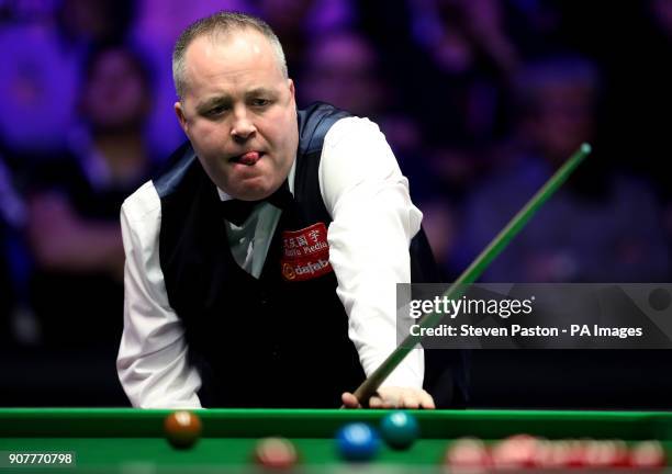 John Higgins reacts during day seven of the 2018 Dafabet Masters at Alexandra Palace, London.