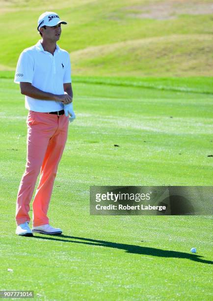 Smylie Kaufman waits to play his shot on the first hole during the third round of the CareerBuilder Challenge at the TPC Stadium Course at PGA West...