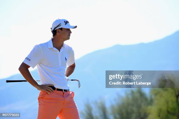 Smylie Kaufman waits to play his shot on the first hole during the third round of the CareerBuilder Challenge at the TPC Stadium Course at PGA West...