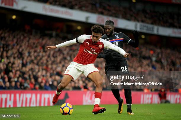 Alex Iwobi of Arsenal in action with Bakary Sako of Crystal Palace during the Premier League match between Arsenal and Crystal Palace at Emirates...