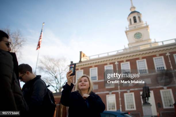 Tourist takes a selfie in front of the shuttered Independence Hall after the government shutdown on January 20, 2018 in Philadelphia, Pennsylvania....