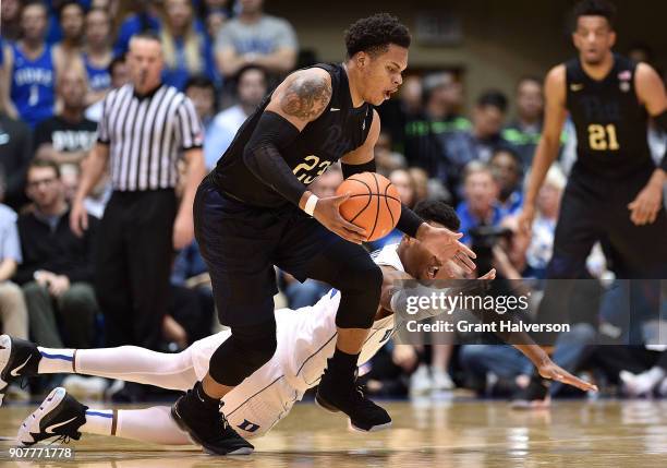 Javin DeLaurier of the Duke Blue Devils battles Shamiel Stevenson of the Pittsburgh Panthers for a loose ball during their game at Cameron Indoor...
