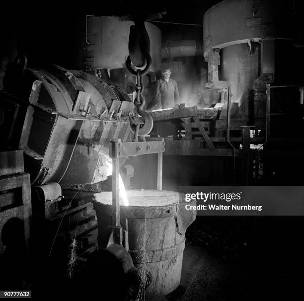 Tapping molten metal at the Thomas Ward Company.Photograph by Walter Nurnberg who transformed industrial photography after WWII using film studio...