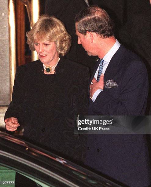 Camilla Parker Bowles and Prince Charles walk out of the Ritz January 28, 1999. More than 100 photographers took up positions outside London's Ritz...
