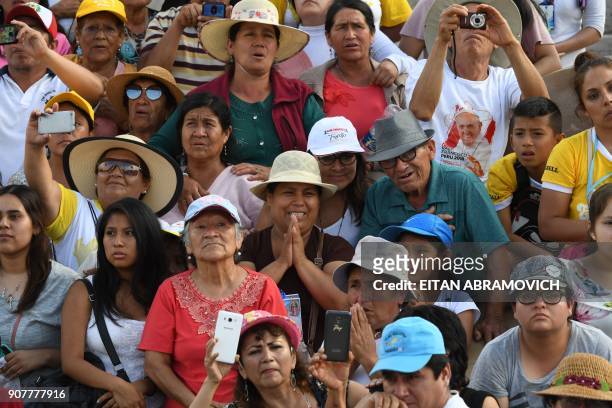 People wait along the streets of the Peruvian city of Trujillo to catch a glimpse of Pope Francis, on January 20, 2018. - Pope Francis condemned...